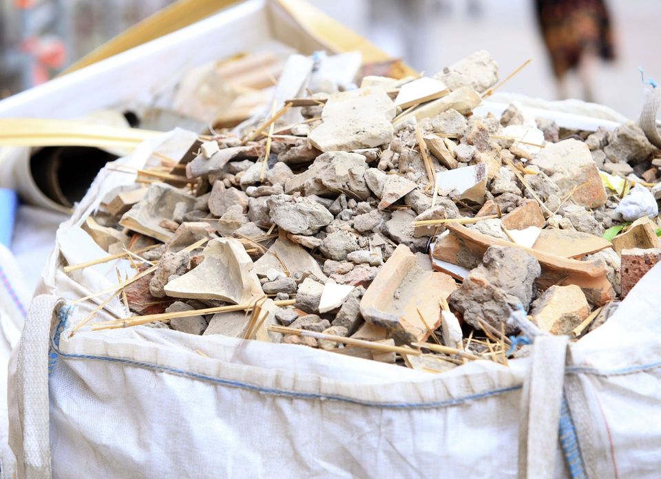 Bulk bag of sorted brick, tile and wood demolition debris ready for recycling